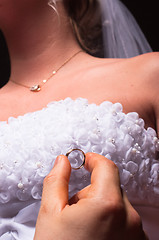 Image showing groom proposing to her bride