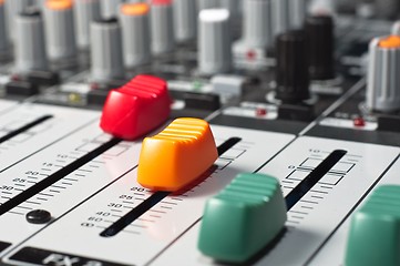 Image showing Part of an audio sound mixer with buttons and sliders