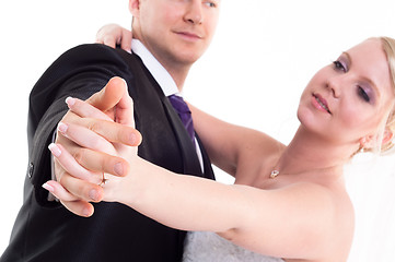 Image showing Holding hand groom and bride enjoying dancing