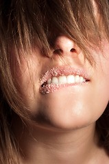 Image showing Closeup of a girl with sugar on her lips