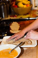 Image showing Fresh meat with flour and crumb on in with the hands of a cook w