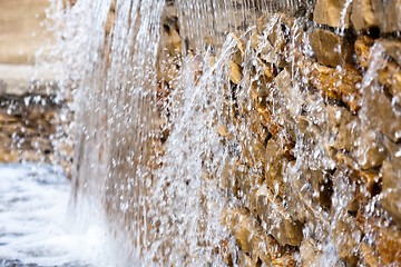 Image showing Fresh water falling down on rocks