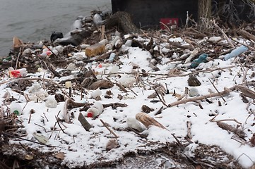 Image showing Pile of garbage covered with snow
