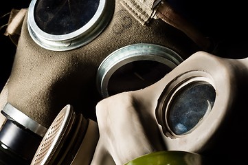 Image showing Two gasmask with focus on the grey one