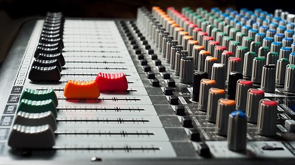 Image showing Part of an audio sound mixer with buttons and sliders