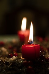 Image showing Christmas candles on girlde with blurry background