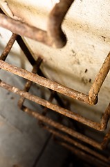 Image showing Rusty ladder leading into hole