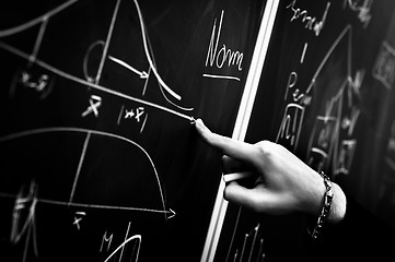 Image showing Pointing on chalk board in black and white