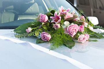 Image showing Wedding flowers on car