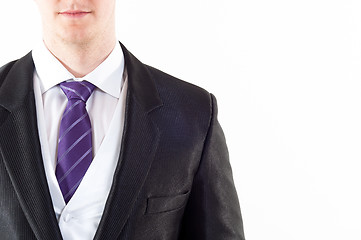 Image showing Young buisnessman with purple tie on white background