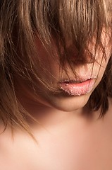 Image showing Closeup of a girl with sugar on her lips