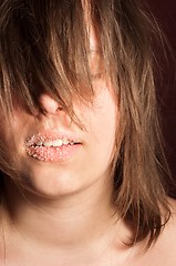 Image showing Girl with sugar on her lips