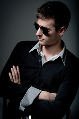 Image showing Young man looking in the opposite side wearing sunglasses