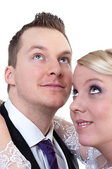 Image showing Bride and groom looking above