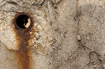 Image showing Rusty hole in concrete wall