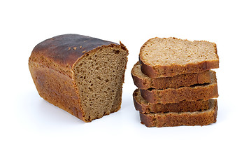 Image showing Half of rye bread with anise and some slices