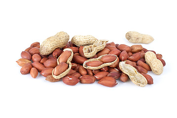 Image showing Some whole, shelled roasted peanuts and husk