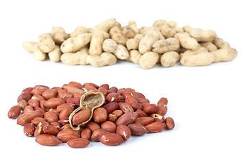 Image showing Shelled roasted peanuts and some husk