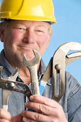 Image showing smiling happy contractor builder with tools