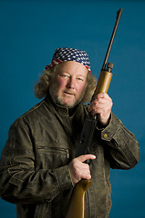 Image showing handsome middle age man flag bandana leather jacket firearm weap