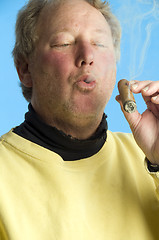 Image showing handsome middle age man smoking expensive cigar