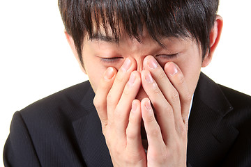 Image showing young man with tired, indifferent expression 