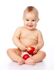 Image showing Little child with apple