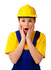 Image showing Construction girl holding her face in astonishment