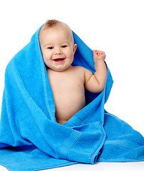 Image showing Cute child wrapped in blue towel