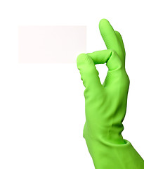 Image showing Hand in green glove showing business card