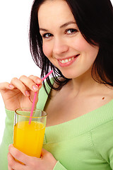 Image showing Young attractive woman drinks orange juice
