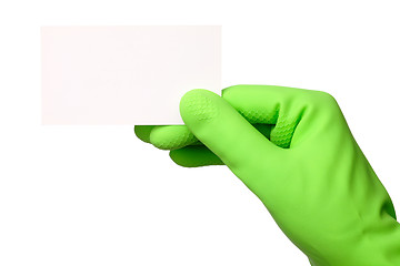 Image showing Hand in green glove showing business card