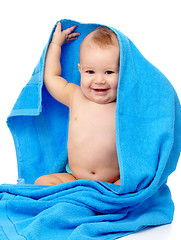 Image showing Cute child wrapped in blue towel