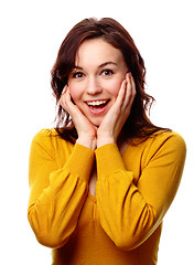 Image showing Girl holding her face in astonishment