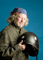 Image showing motorcycle rider with helmet American flag bandana