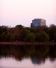 Image showing Business centre reflecting in the lake