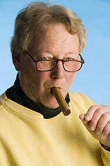 Image showing handsome cigar smoking middle age senior man worn turtleneck shi