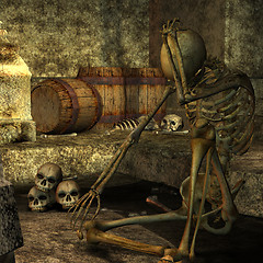 Image showing skeleton sitting in the dungeon