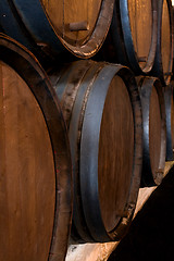 Image showing stacked wine barrels in the wine cellar 