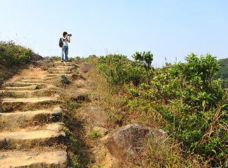 Image showing hiking photographer