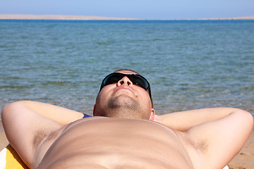 Image showing funny tourist face in sunglasses