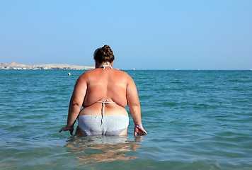 Image showing overweight woman bath in sea