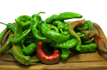 Image showing Hot peppers on wooden kitchen board