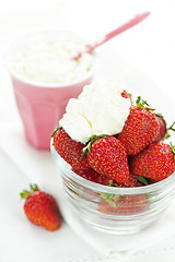 Image showing Bowl of strawberries with whipped cream