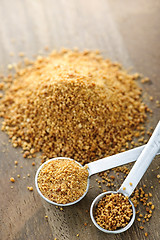 Image showing Coconut palm sugar in measuring spoons