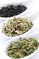 Image showing Assortment of dry tea leaves in spoons