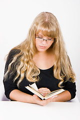 Image showing girl with long hair reads
