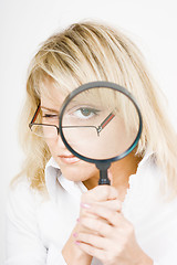 Image showing girl with a magnifying glass