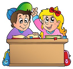 Image showing Two children at school desk