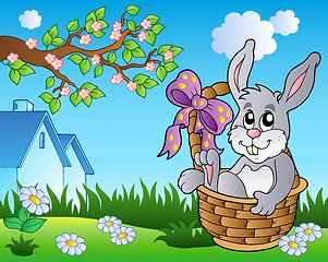 Image showing Spring meadow with bunny in basket